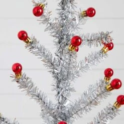 4 Ft. Artificial Retro Silver Tinsel Christmas Tree With 50-Red Mini Ornament Balls And Wooden Base 11 4 Ft. Artificial Retro Silver Tinsel Christmas Tree With 50-Red Mini Ornament Balls And Wooden Base -Holiday Glow Store nearly natural unlit christmas trees t5402 4f 1000